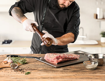 https://elitemeatsupply.com/cdn/shop/articles/man-cooking-meat-steak-kitchen_360x.jpg?v=1685988640